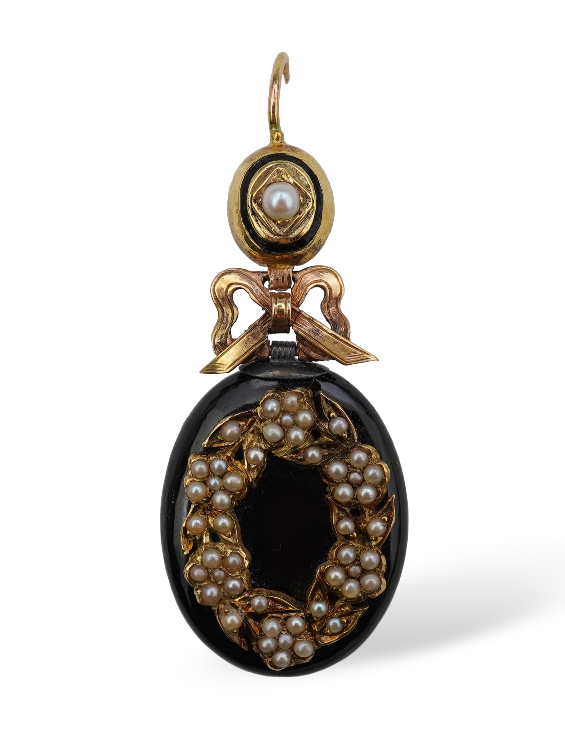 An onyx and seed pearl mourning locket pendant, late 19th century